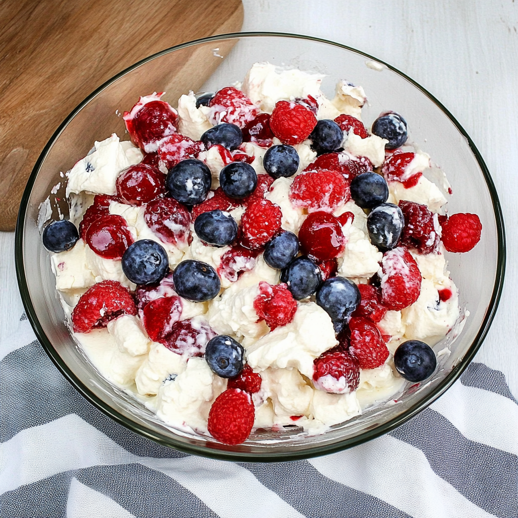 Recipe preparation for Red White & Blue Cheesecake Salad